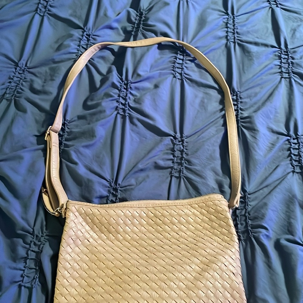 Beige purse worn two ways- over the shoulder or wristlet